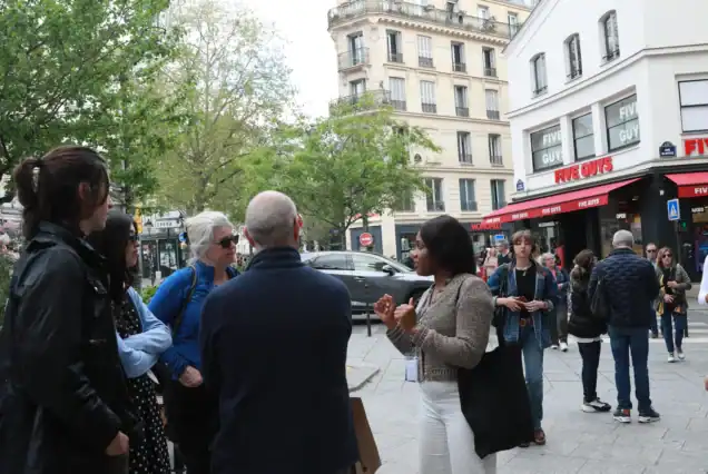 Group photo taken at the steps of Sacré-Cœur during our Montmartre walking tour with clients