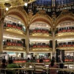 Shopping in Paris department stores like Galeries Lafayette and Le Bon Marché”