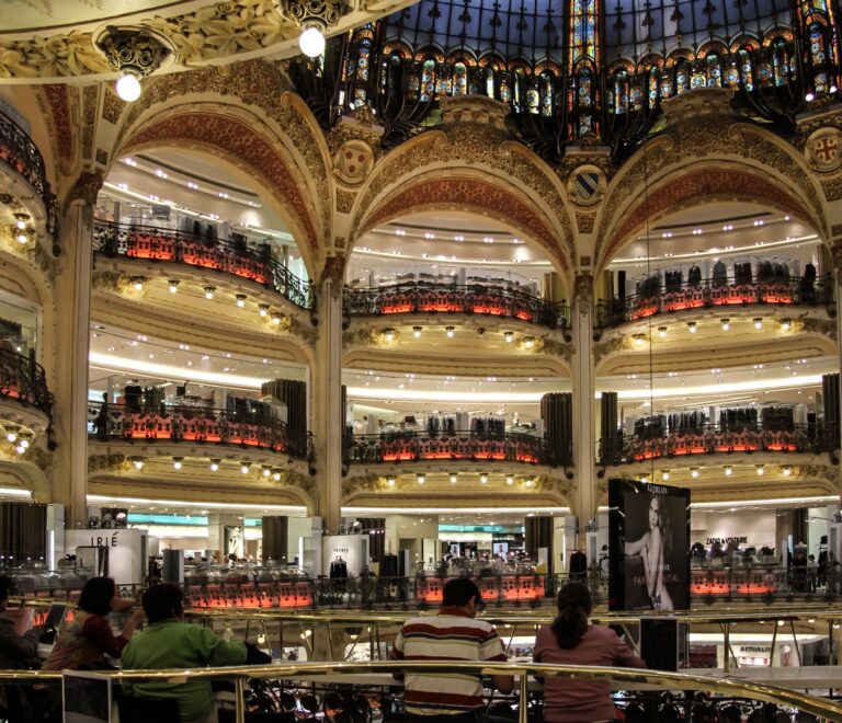 Shopping in Paris department stores like Galeries Lafayette and Le Bon Marché”