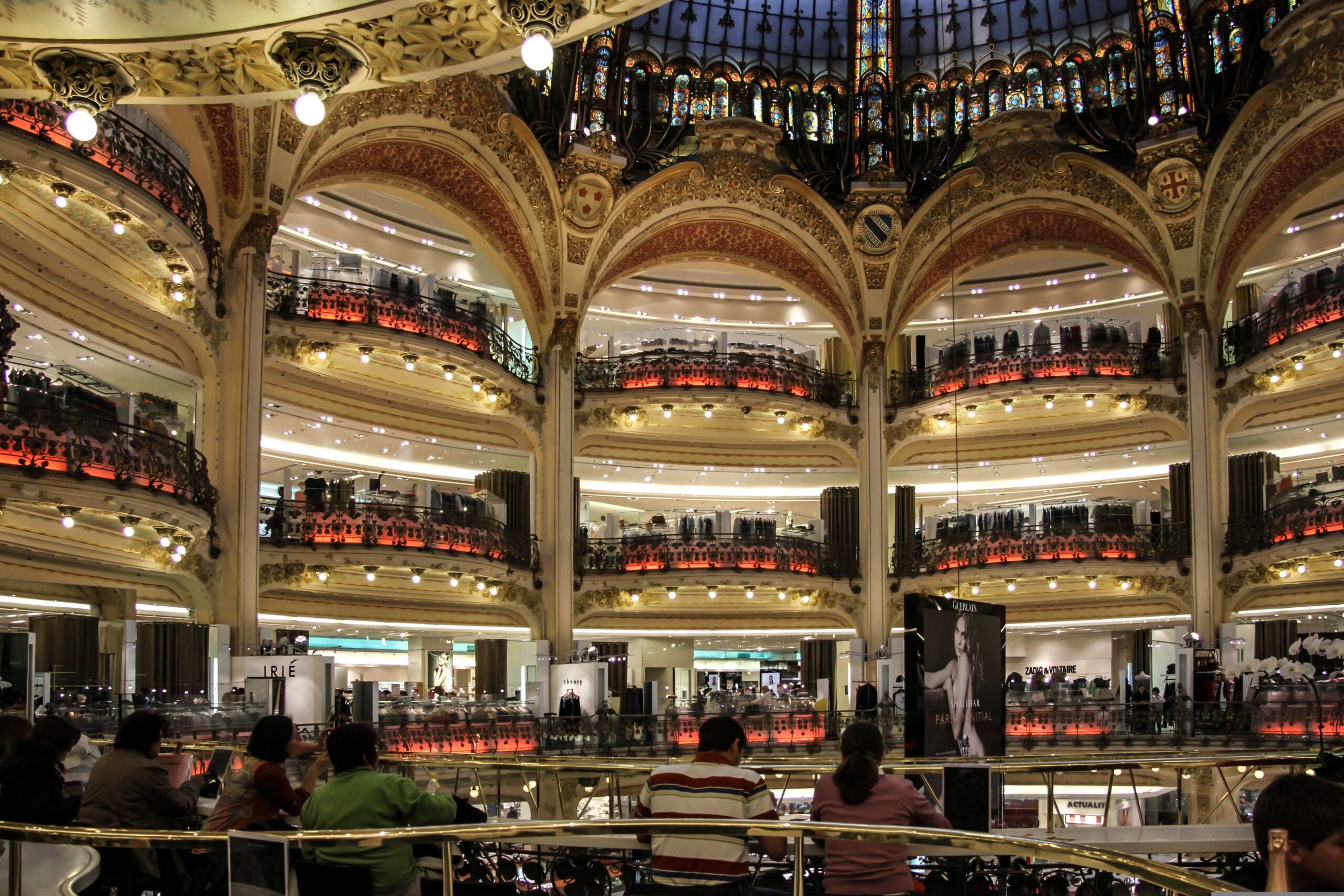 Shopping in Paris department stores like Galeries Lafayette and Le Bon Marché”