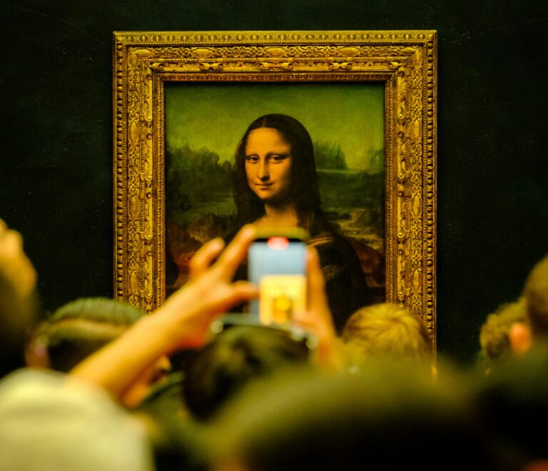 The Mona Lisa painting displayed in the Louvre Museum in Paris